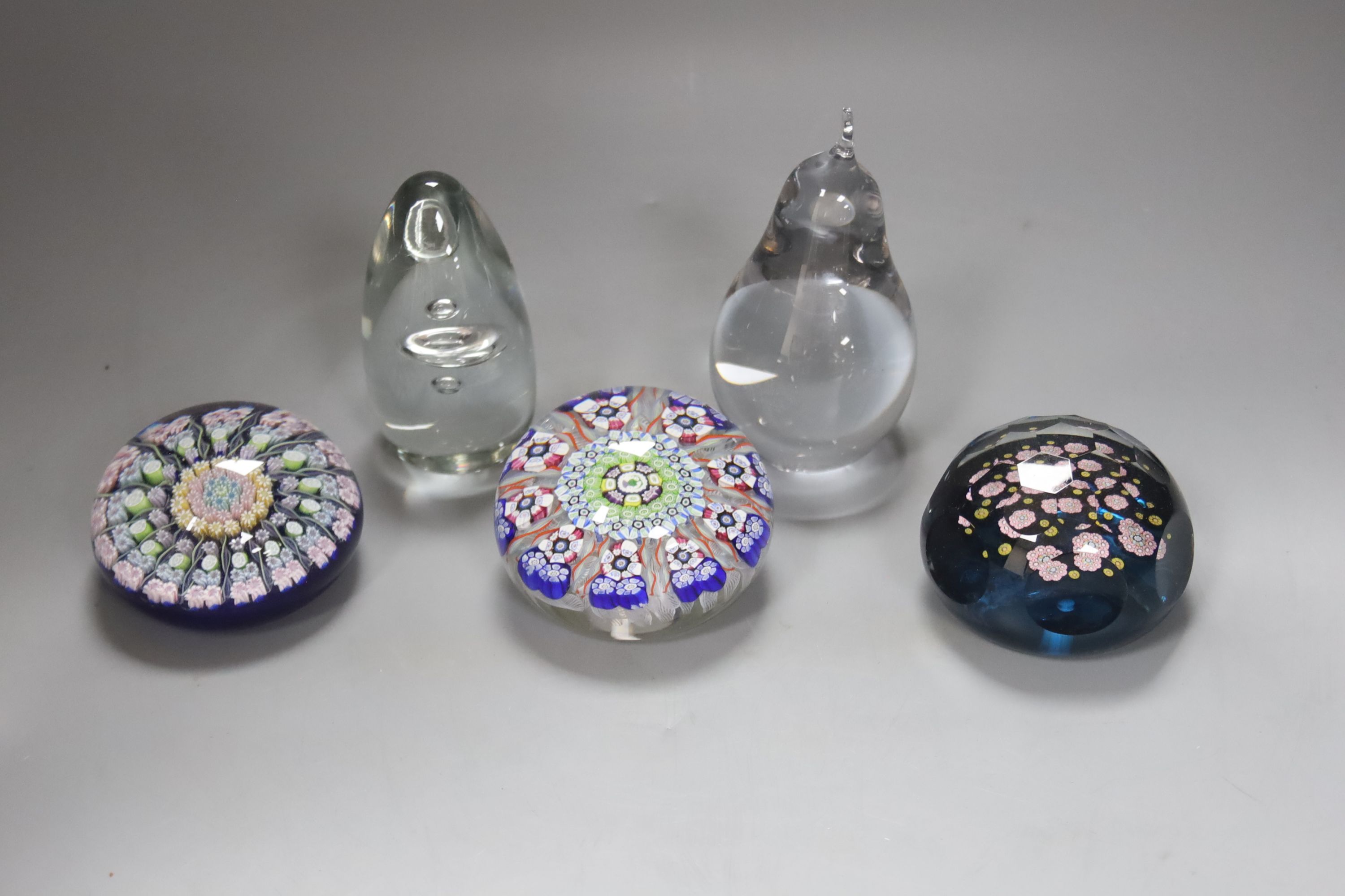 A selection of Scottish and other glass paperweights to include two Perthshire Millefiori examples, another millefiori and two Wedgwood